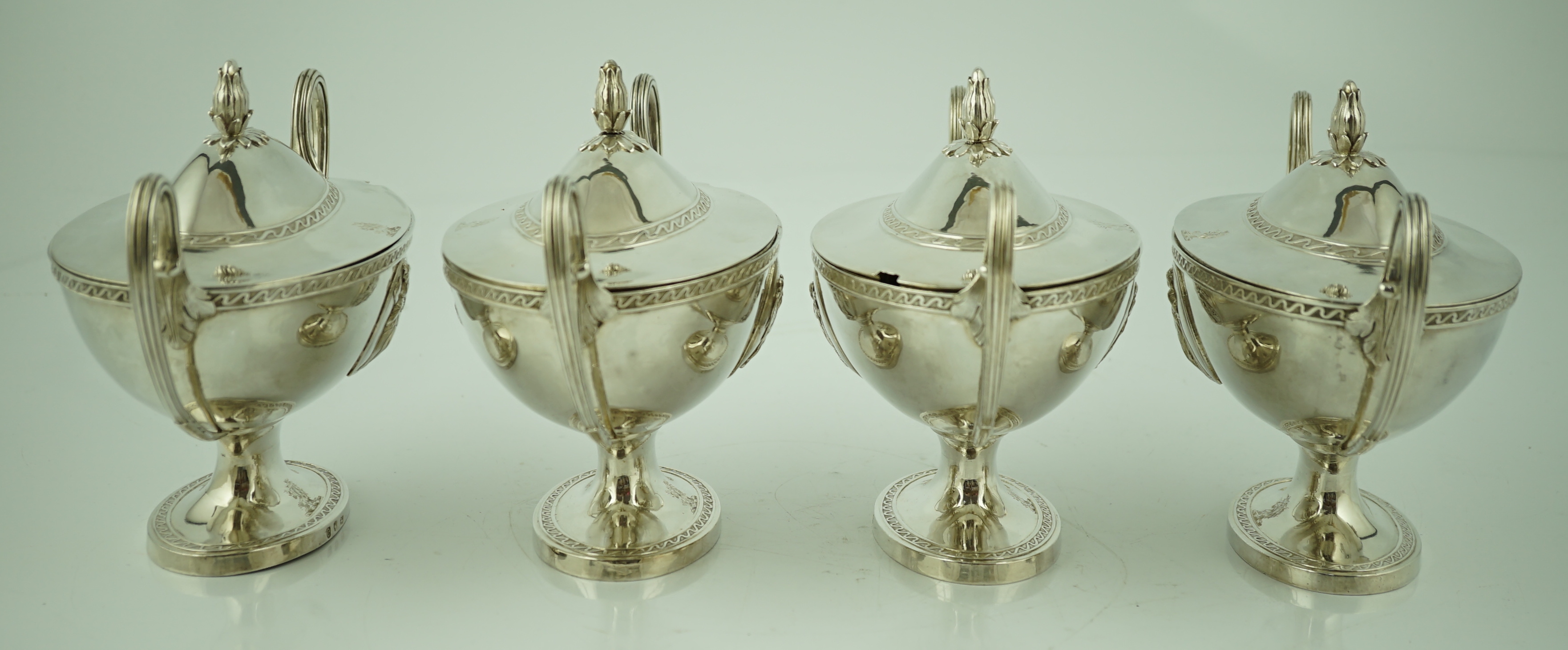 A good set of four George III silver oval pedestal sauce tureen's and covers